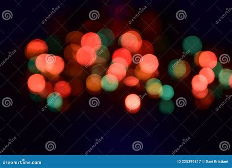 Red And Green Blurry Light Dots In The Dark Night Background Stock