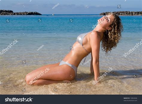 Sexy Woman Sitting Seaside Bikini Under Stock Photo 13854946 Shutterstock