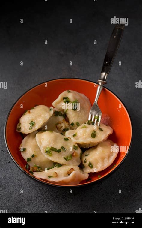 Potato Dumplings With Fried Bacon And Green Onions Stock Photo Alamy