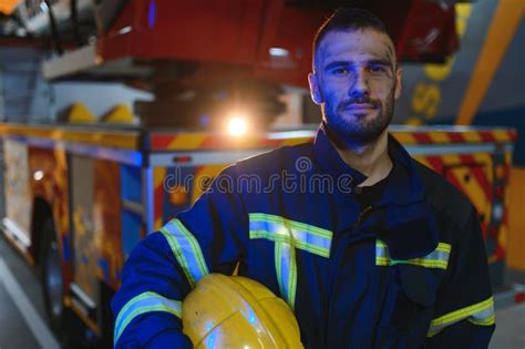 Photo Of Fireman With Gas Mask And Helmet Near Fire Engine Stock Photo