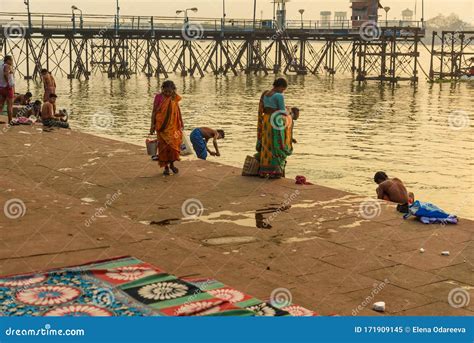 Indian People Bathing In River Hooghly Or Ganga At Mallick Ghat In