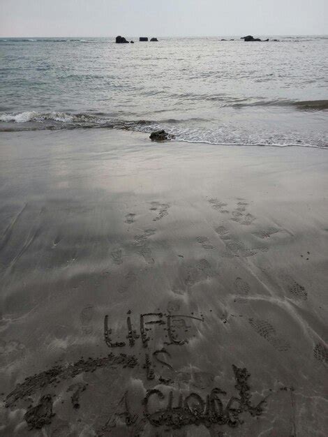 Premium Photo Close Up Of Text On Sand At Beach