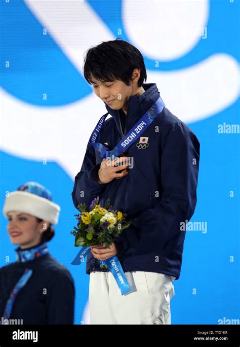 Japan S Gold Medalist Yuzuru Hanyu Celebrates During The Medal Ceremony