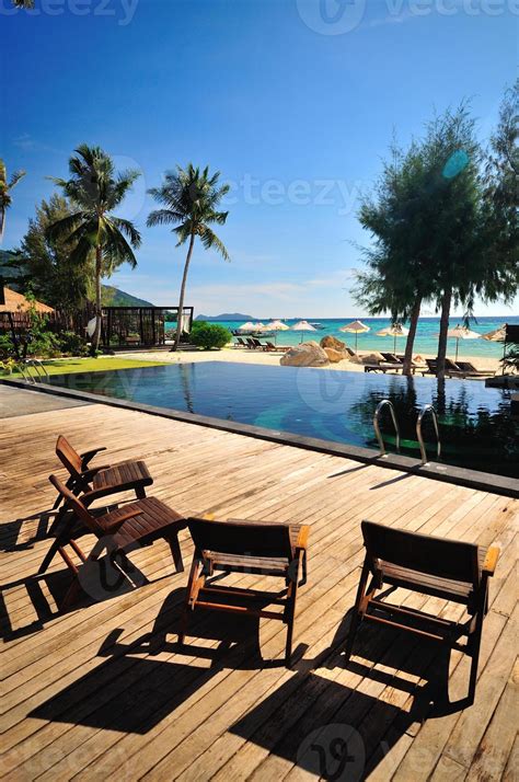 Beach chair and umbrella on sand beach 11550732 Stock Photo at Vecteezy