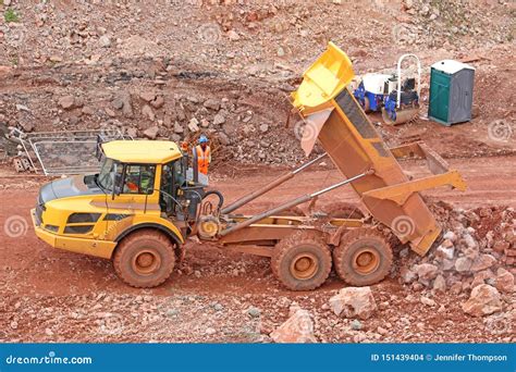 Dump Truck Tipping On A Road Construction Site Editorial Stock Image