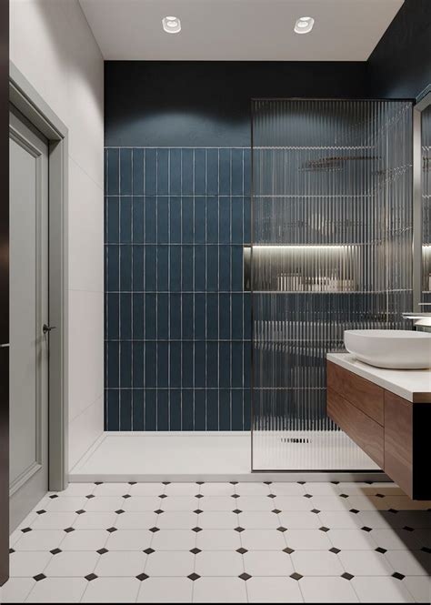 A Bathroom With Black And White Tiles On The Walls Flooring And Shower