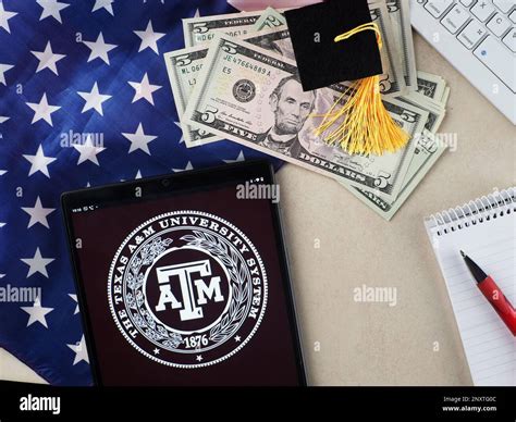 In this photo illustration, a Texas A&M University logo seen displayed ...