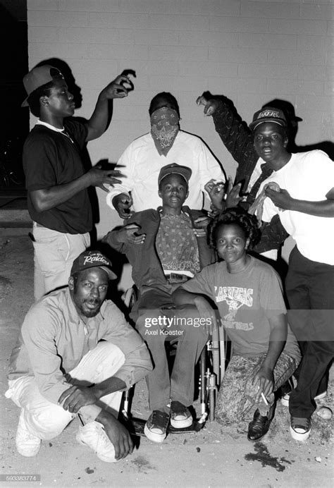 News Photo Members Of The Grape Street Crips Pose Throwing Tupac