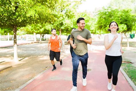 Active Friends Running Together At The Track Stock Photo Image Of