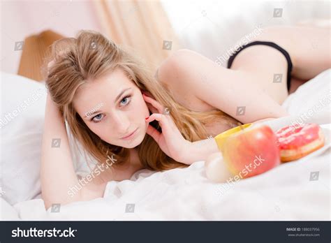 Стоковая фотография Sexy Blonde Girl Lying On White Shutterstock