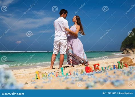 Happy Couple At Beach Holds Hands Sea Travel At Hawaii Stock Image