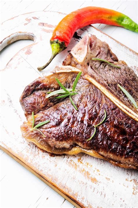 Grilled Ribeye Sirloin Steak With Spices On Cutting Board Photo Picture