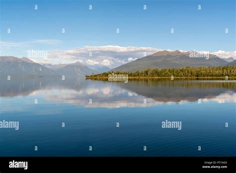 Lake Te Anau and Fiordland National Park mountains from Te Anau Downs ...