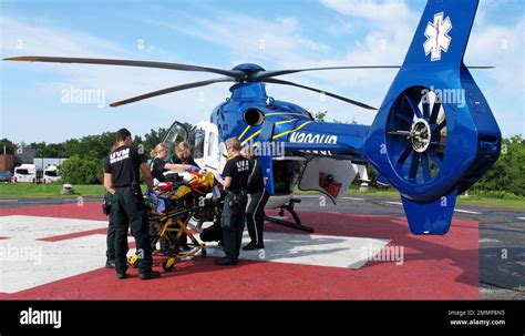 Emergency Workers Off Load A Patient From A Helicopter At The