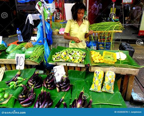 Market Vendor Selling Vegetables In A Market In Philippines Editorial