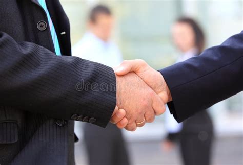 Business People Shaking Hands Over A Deal Stock Photo Image Of