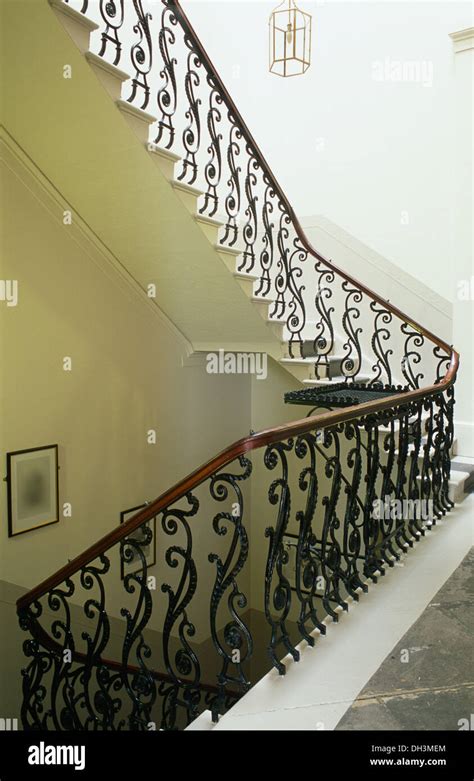 Ornate Wrought Iron Banister In On Staircase And Landing In Elegant