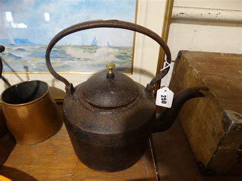 An Antique Cast Iron Kettle