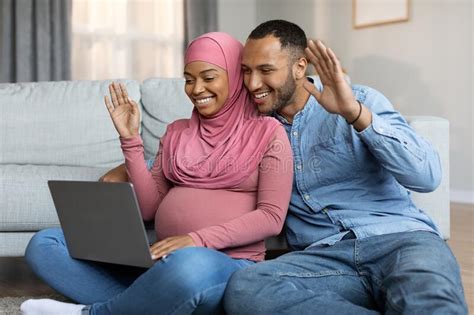 Black Muslim Spouses Expecting Baby Making Video Call With Laptop At