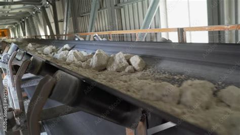 Limestone On The Conveyor Cement Production Factory On Mining Quarry