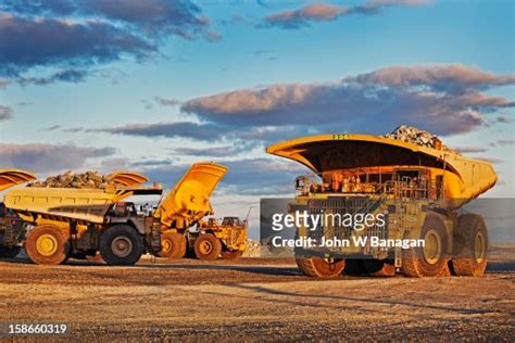 Dump Trucks Dumping Rocks At A Gold Mine High-Res Stock Photo - Getty ...