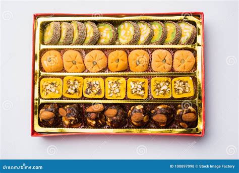 Indian Sweets Or Mithai For Diwali Festival With Oil Lamp Or Diya And