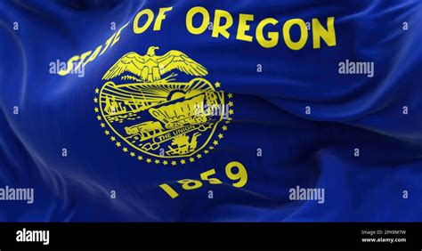 Close Up Of The Oregon State Flag Waving Oregon Is A State In The