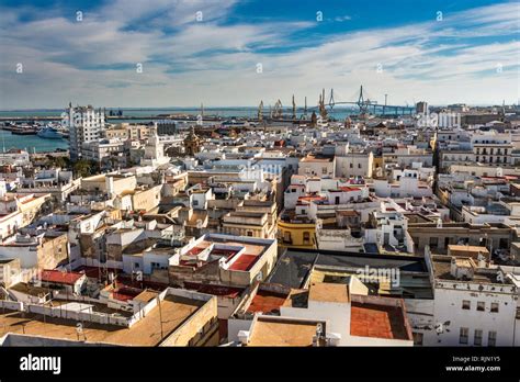 Aerial East View Of Buildings Near Port Of The Bay Of Cadiz In The Far