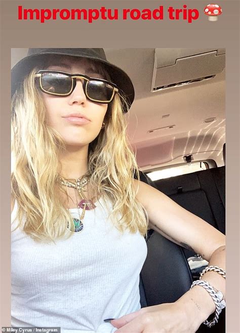 Miley Cyrus Flaunts Her Toned Figure In A Tiny Black Bikini While On Vacation Daily Mail Online