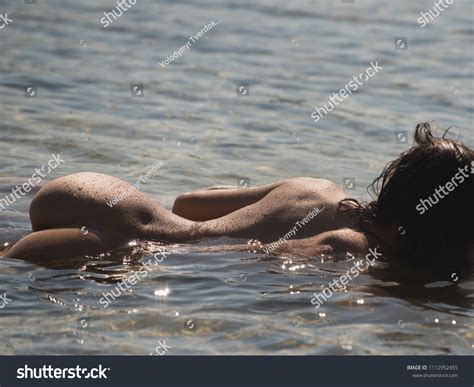 Naked Woman On A Beach Shutterstock