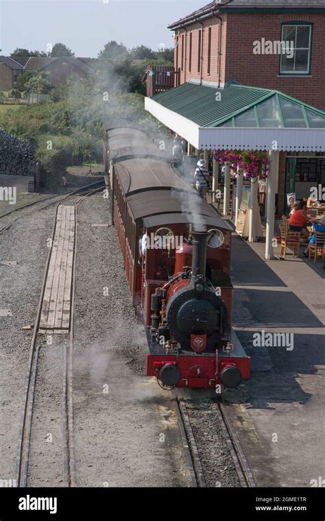 A train waits at Tywyn Wharf Station at the The Talyllyn Railway, Gwynedd, Wales. The Talyllyn ...