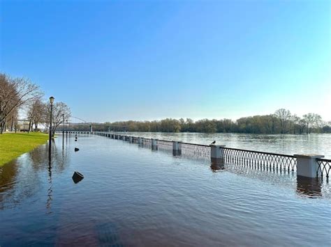 Premium Photo Embankment Flooded With River Water