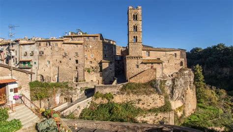 An Old Stone Building On Top Of A Hill With Stairs Leading Up To The