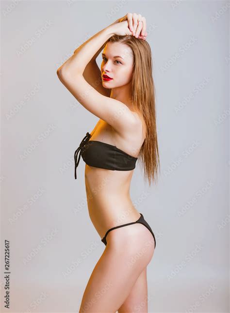 Beautiful Sporty Girl In Black Bikini Posing In Studio Photo Of Attractive Blonde Girl With