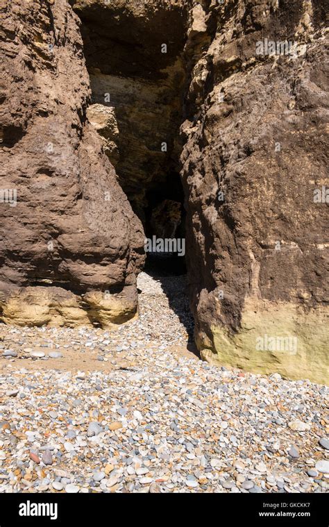 Caves Eroded From Cliffs Of Yellow Coloured Magnesian Limestone Rock At