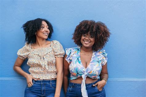 Premium Photo Two Africanamerican Women Standing In Front Of A Wall