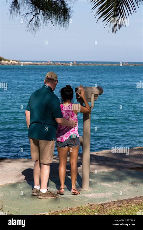 Tourists In Jetty Park Look Across The Waters Of Florida S Fort Pierce