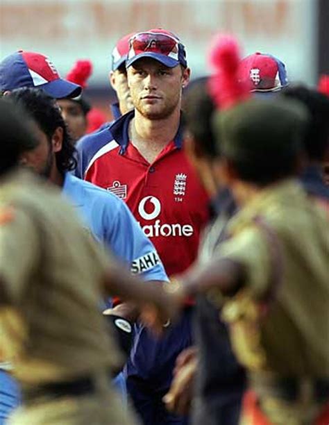 A glum-looking Andrew Flintoff makes his way off the pitch ...