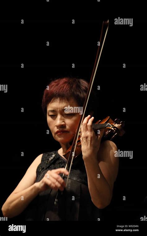 Korean Violinist Kyung Wha Chung Performs During A Concert In Shenzhen