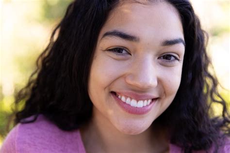 Premium Photo Close Up Portrait Of Happy Biracial Woman In Sunny Nature