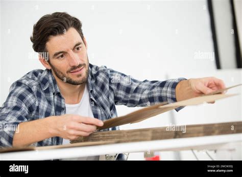 man assembling a cut out cardboard box Stock Photo - Alamy