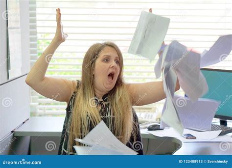 Businessman At His Desk Throws Documents And Papers Into The Air Stock