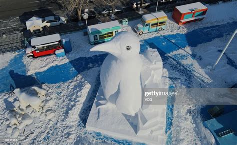 A 10-meter-tall penguin snow sculpture stands at Harbin Polarland on ...