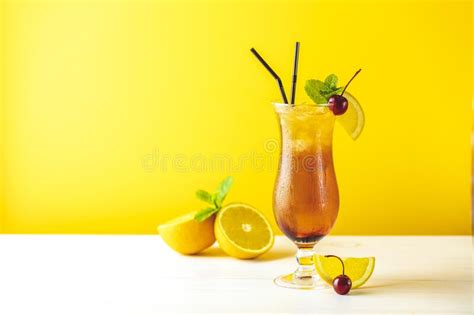 Sex On The Beach Cocktail In Glass With Water Drops On Yellow Background Close Up Shallow