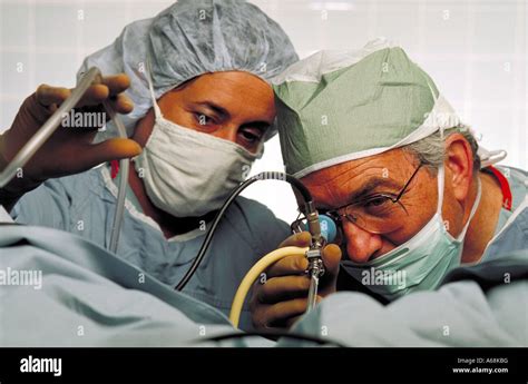 Obstetrician gynecologist surgeon conducts endoscopic surgery Stock ...