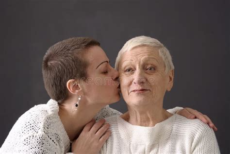 Mature Woman Giving A Kiss At Senior Woman Stock Image Image 9086851