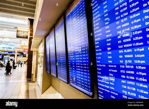 Finding A Flight On Arrivals Departures Display Hi Res Stock