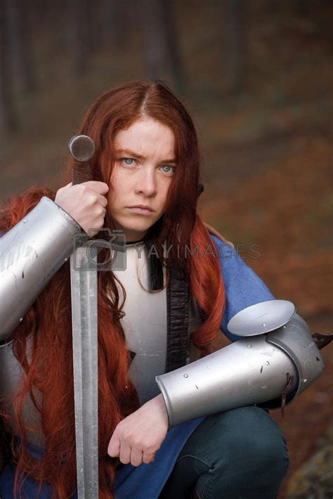 Portrait Red Haired Girl In Medieval Knights Armor In Summer Forest By