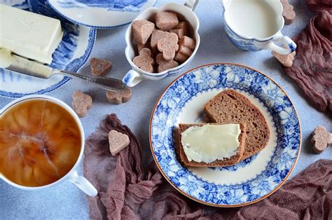 Premium Photo Coffee With Milk And Bread With Butter