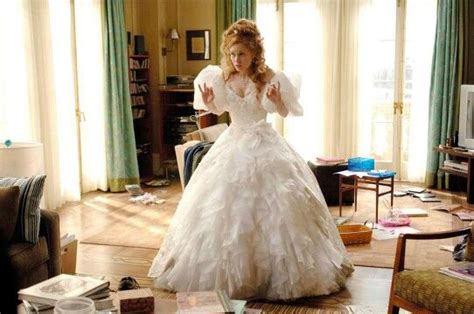 A Woman In A Wedding Dress Standing In A Living Room